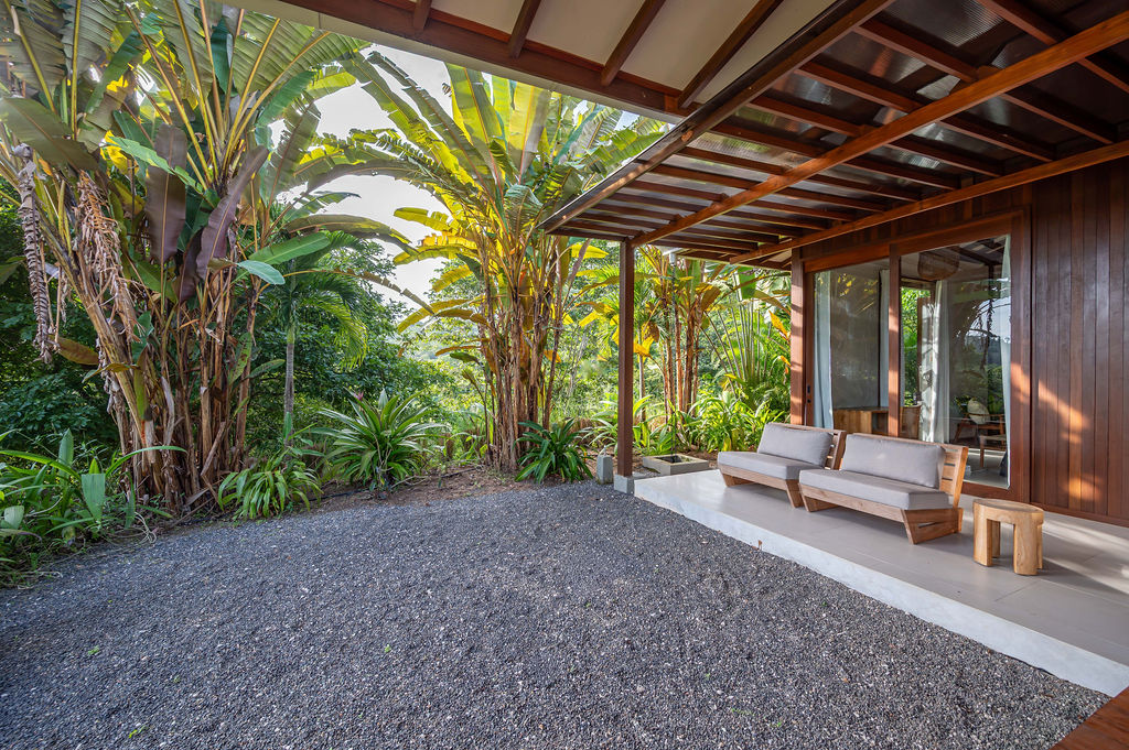 Bedroom two terrace seating tucked beneath the timber overhang