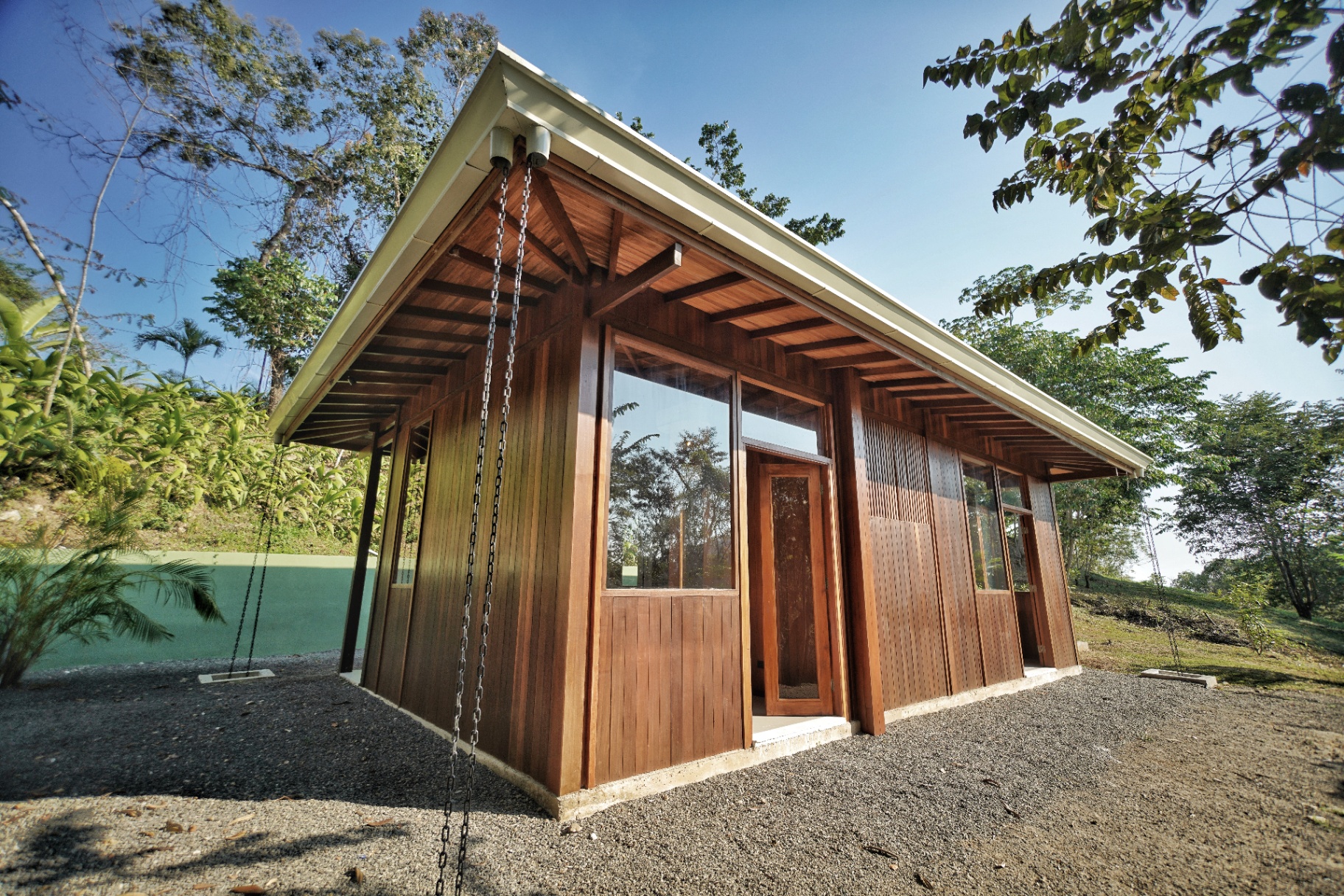 Jungle residence side elevation, teak panels and glazing